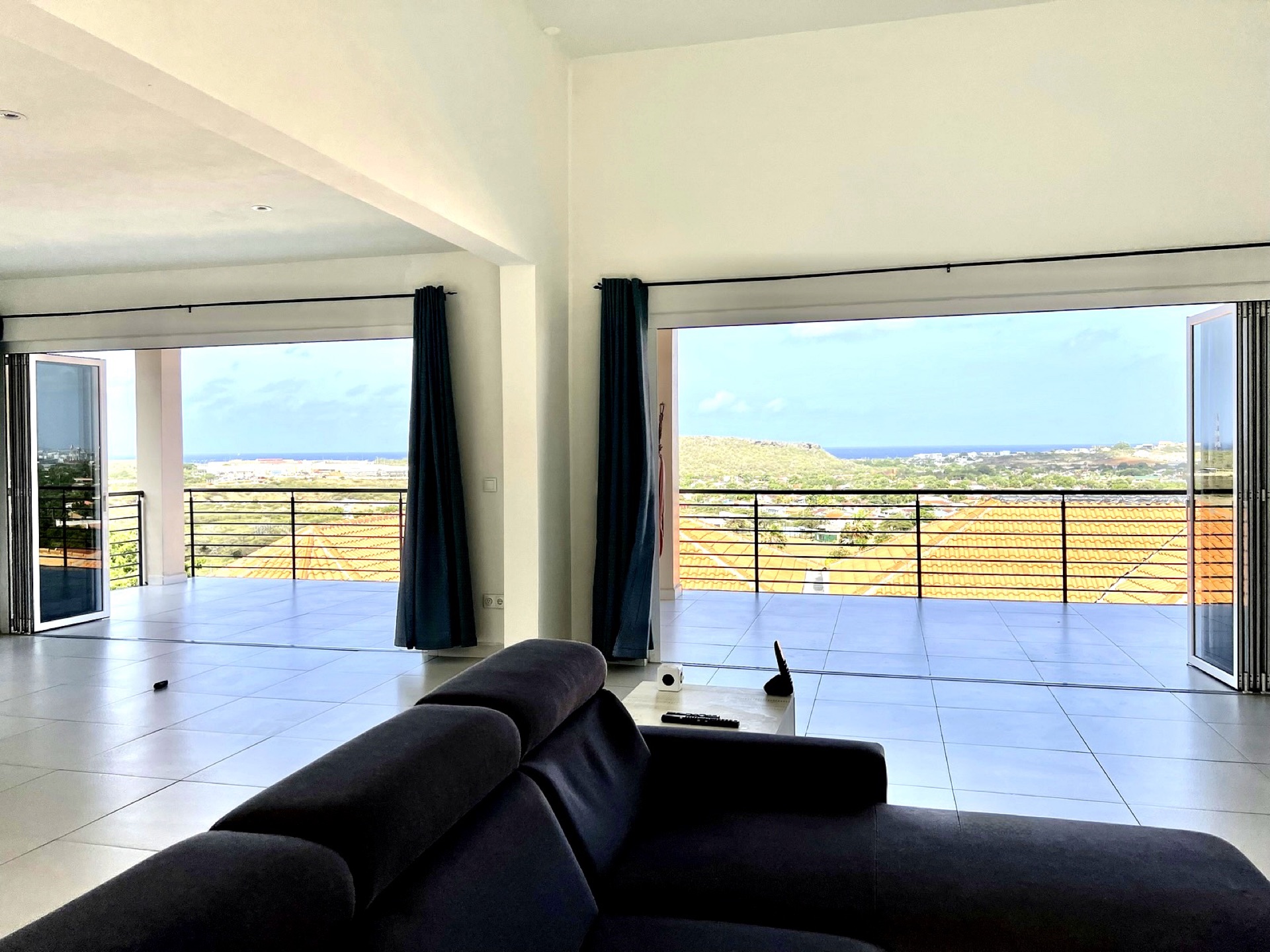 Open-plan living room with panoramic sea view